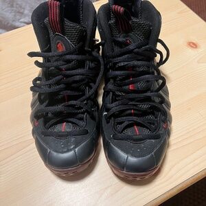 +1 This is a Nike Air Foamposite One "Cough Drop" in black and varsity